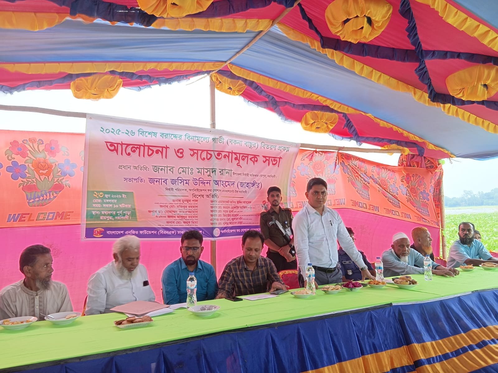 Awareness meeting panel under tent.